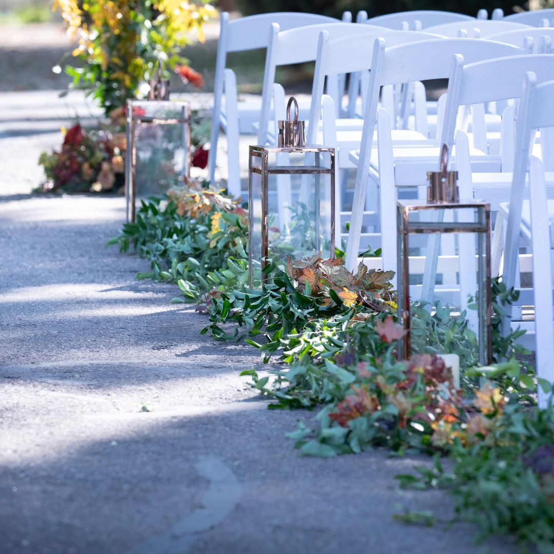 Fall wedding aisle with greenery, rose gold lanterns and seasonal florals — The Joyful Poppy Fort Collins CO
